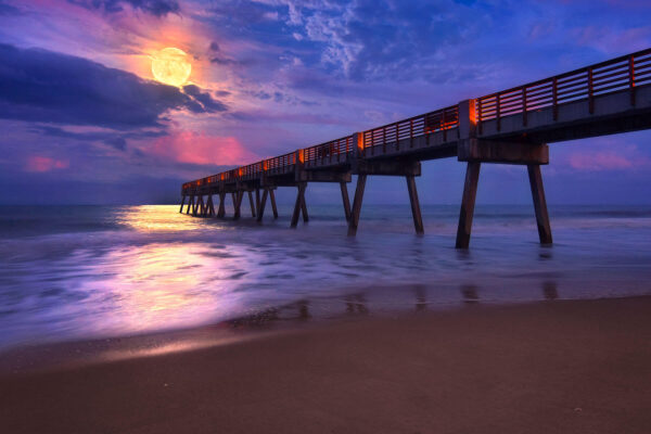 Full Moon rising over Vero Beach Pier in Florida