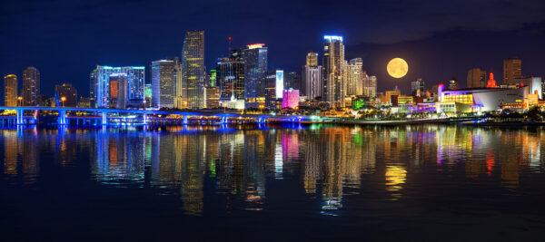 Full Moon setting over Downtown Miami Florida Cityscape by Justin Kelefas